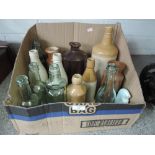 A selection of salt glazed and vintage glass bottles, including Gazey's Barrow-in-Furness, Baxter'