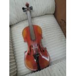 A traditional violin, probably 19th Century having two piece back, cased with bow, also spare case