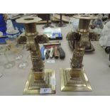 Two solid brass cast antique candle sticks in a Victorian style