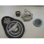 A selection of Royal Observer Corps badges and patch including unusual 'Il Faut En Finir' Ring