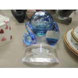 A selection of blue glass ornaments including large paper weight, swan figure etc