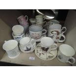 A large selection of ceramic mugs including Wedgwood coronation ware etc