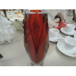 A vintage heavy geometric cut glass vase with ruby glass inset