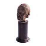 A male head in the Grotesque styleEgypt, 2nd - 1st century BC; alt. cm 7; A small head set on a