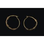 Pair of Roman gold earrings1st – 2nd century AD; diam. mm 16; Pair of gold earrings with circular