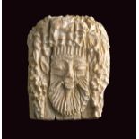 Ivory plaque in shape of Silenus headGreek production, 7th – 6th century BC; alt. cm 3,8; Ivory