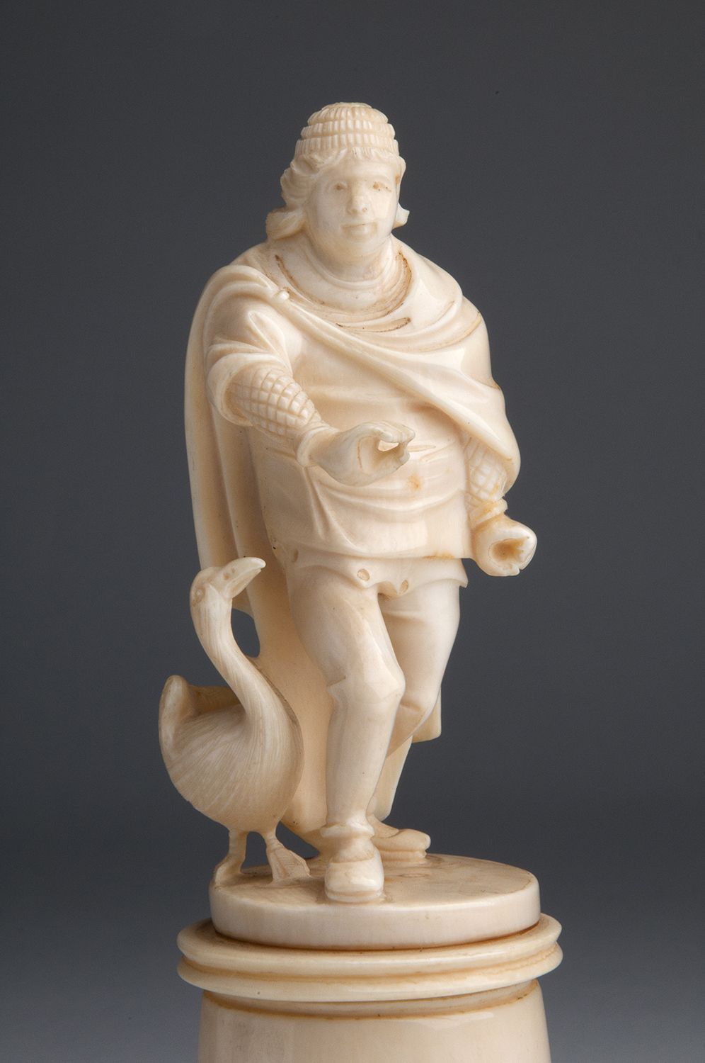 A carved ivory figural group of male figure with a goose - probably France, late 19th / early 20th - Image 8 of 9