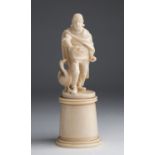 A carved ivory figural group of male figure with a goose - probably France, late 19th / early 20th