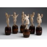 A carved ivory six figures of musicians - Germany, circa 1880; ; on a wooden turned barrel bases.
