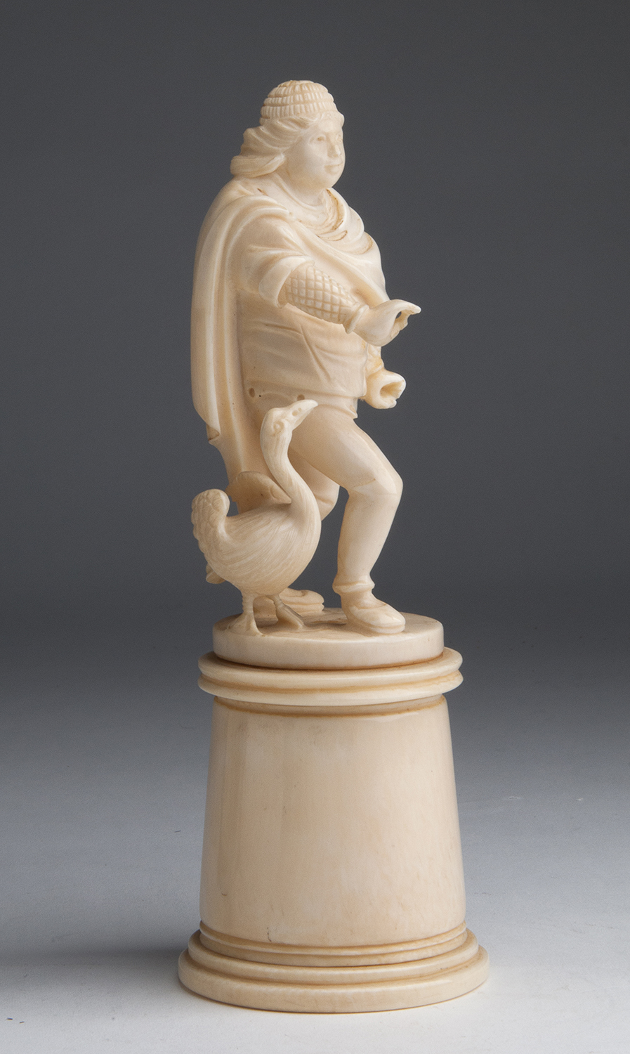 A carved ivory figural group of male figure with a goose - probably France, late 19th / early 20th - Image 3 of 9