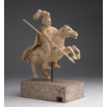 "Saint George". A carved ivory equestrian figure - Germany, 18th Century; ; on a travertine modern