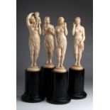A carved ivory group of four female figures depicting "The Sight", "The Hearing", "The Taste" and "