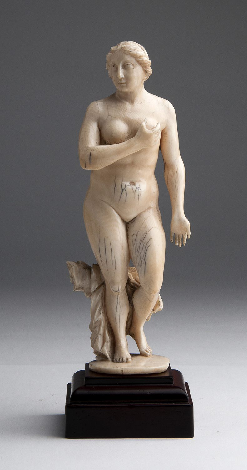 "Venus". A carved ivory - possibly Portugal, 17th Century; ; on a wooden base. 20.5 cm, 8 5/64 in