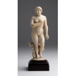 "Venus". A carved ivory - possibly Portugal, 17th Century; ; on a wooden base. 20.5 cm, 8 5/64 in