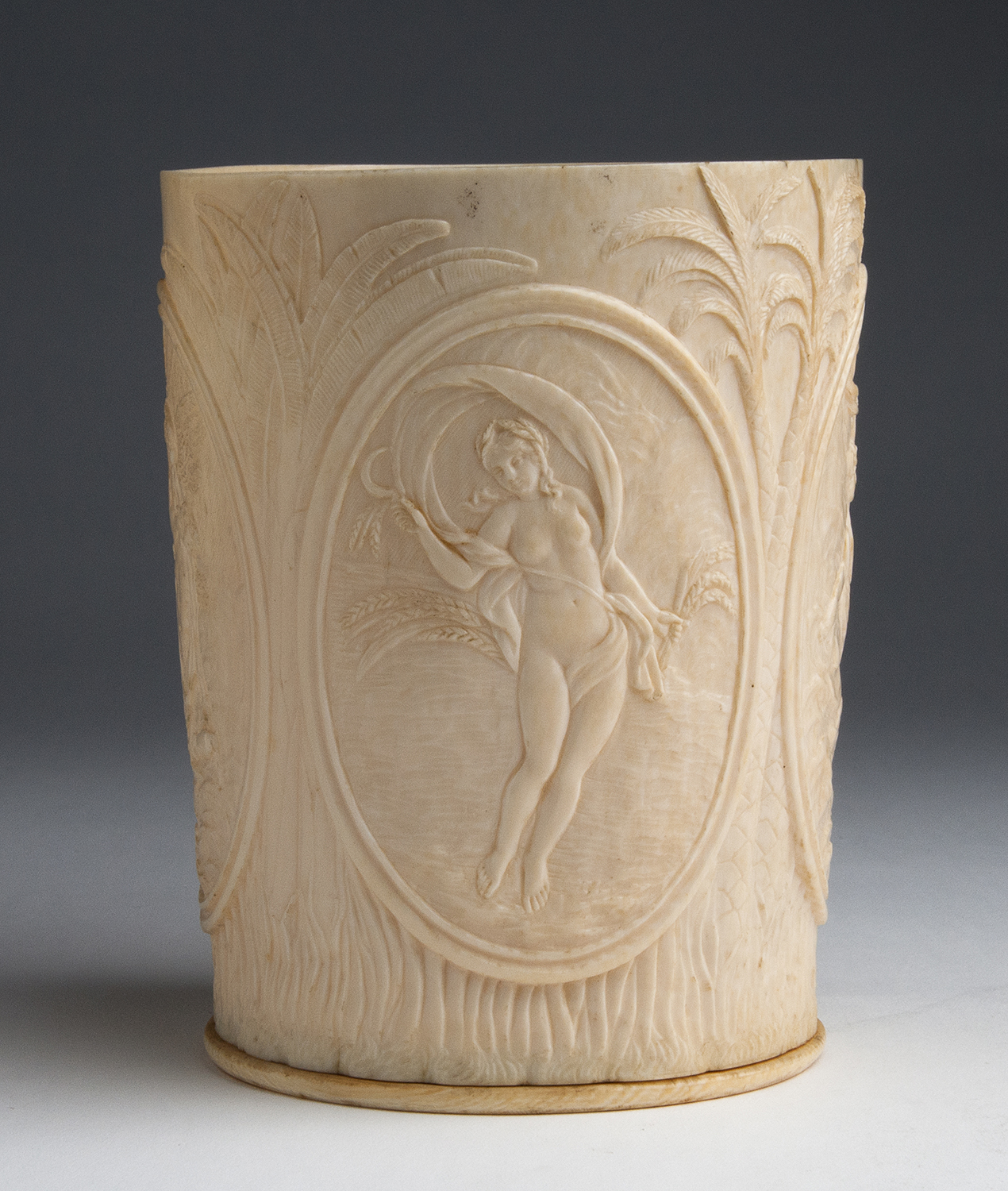 "The Four Seasons". A carved ivory vase - Colonial India, late 19th; ; 14.5 cm, 5 45/64 in high,