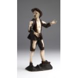 A carved ivory and lime wood figure of a beggar - Lucerne, late 18th Century; ; on a wooden base.