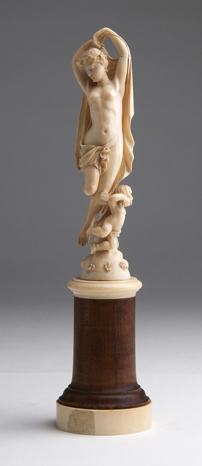 A carved ivory allegorical female figure - France, late 19th Century; ; on a ivory and wood base.