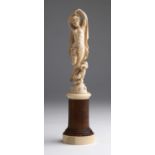 A carved ivory allegorical female figure - France, late 19th Century; ; on a ivory and wood base.