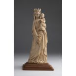 "Virgin and Child". A carved ivory figural group - probably France, late 18th Century; ; on a modern