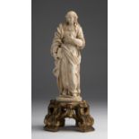 "Saint Barbara". A carved ivory figure - France, late 17th Century; ; on a gilded wood base. 26