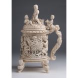 An ivory tankard finely carved with Bacchanalian scenes, Venus, Putti and Satyrs - Germany, 19th