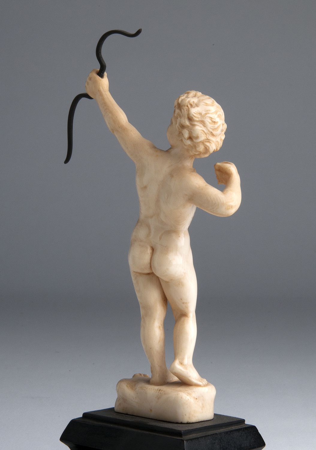 “Cupid”. A carved ivory figure depicting Cupid while shooting an arrow - France, 19th Century; ; - Image 5 of 5