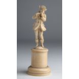 A carved ivory figure of musician - probably England, 19th Century; ; on ivory base. 16,4 cm, 6 29/