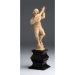 A carved ivory figure of a Minstrel - Naples, 18th / 19th Century; ; on a wooden base. 20 cm, 7 7/