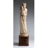 "Moses". A carved ivory figure - probably France, 19th Century; ; on a carved wooden base. 72.5