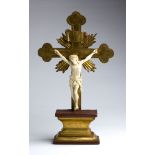 A carved ivory Crucifix - France, late 18th / early 19th Century; ; standing on a gilt wood plinth