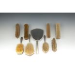 A GROUP OF NINE SILVER AND TORTOISE SHELL VANITY ACCESSORIES, including hand mirror, clothes brushes