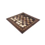 A LATE 19TH /EARLY 20TH CENTURY FOLD-OVER CHESSBOARD WITH INLAID MOTIF 'IN VERITAS VINO', with a set
