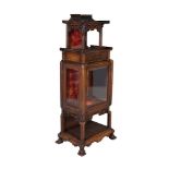 A STAINED WOOD CHINOISERIE DISPLAY CABINET, early 20th century, with an open pagoda top above a