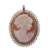 A CAMEO PENDANT/BROOCHThe cameo depicting the face of a lady, yellow metal unmarked and untested,