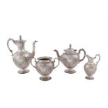 A VICTORIAN FOUR PIECE SILVER TEA AND COFFEE SERVICE, Sheffield 1864, maker's mark of Martin