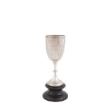 A VICTORIAN SILVER STEM CUP, London 1889, maker's mark of William Hutton & Sons, the cup with Wyvern