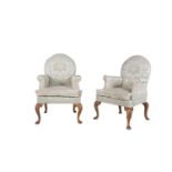 A PAIR OF GEORGE III STYLE WALNUT ARMCHAIRS upholstered in patterned damask on cabriole legs with