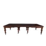 A LARGE VICTORIAN MAHOGANY EXTENDING DINING TABLE, with thumb moulded rim, plain apron, raised on