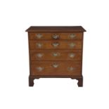A 19TH CENTURY MAHOGANY RECTANGULAR CHEST, of four long drawers with brass handles on bracket