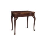 AN IRISH GEORGE III MAHOGANY SHAPED RECTANGULAR CARD TABLE, the folding top with rounded corners,