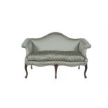 A GEORGE III MAHOGANY FRAMED HUMP BACK TWO SEAT SOFA, with scroll arm supports, upholstered in green