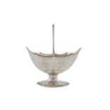 A GEORGE III OVAL HELMET SHAPED SUGAR BOWL, London, with reeded swing handle, beaded rim, and