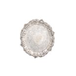 AN IRISH GEORGIAN SILVER WAITER, Dublin 1821, mark of William Nolan, of shaped circular form, with