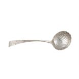 AN EARLY GEORGE III IRISH CURVED TAPER HANDLE SAUCE LADLE, Dublin c.1760, mark of David Peter,