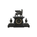 A LATE VICTORIAN BLACK MARBLE EGYPTIAN REVIVAL MANTEL CLOCK, surmounted by a model of a mythical