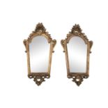 A PAIR OF SMALL ITALIAN CARVED GILTWOOD MIRRORS, 19th century, with arched tops and pierced