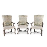 A SET OF FOUR GEORGE III STYLE MAHOGANY FRAMED ELBOW CHAIRS the tapestry upholstered backs, outswept