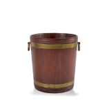 A MAHOGANY BRASS-BANDED BUCKET of coopered construction, Irish c.1800, with large brass drop-