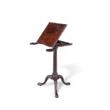 A FINE GEORGE III MAHOGANY RECTANGULAR READING STAND, the hinged adjustable top with pop out