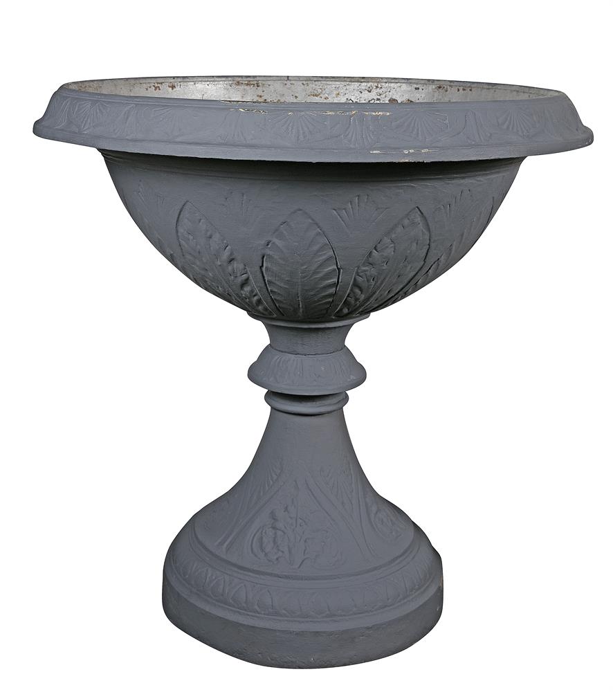 A LARGE PAIR OF VICTORIAN CAST IRON URNS, of circular urn form, the wide flared rims with